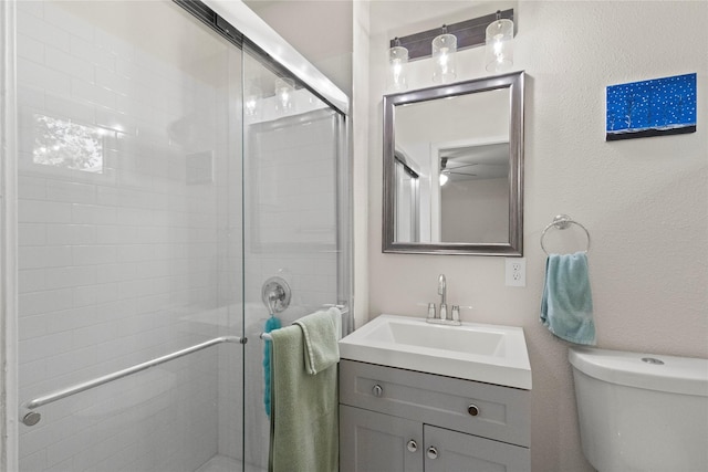 3122 Old Orchard Rd, Garland, TX 75041 - bathroom with vanity, a shower stall, and ceiling fan