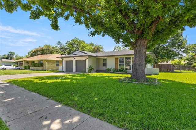 3122 Old Orchard Rd, Garland, TX 75041 - ranch-style home featuring a garage and driveway