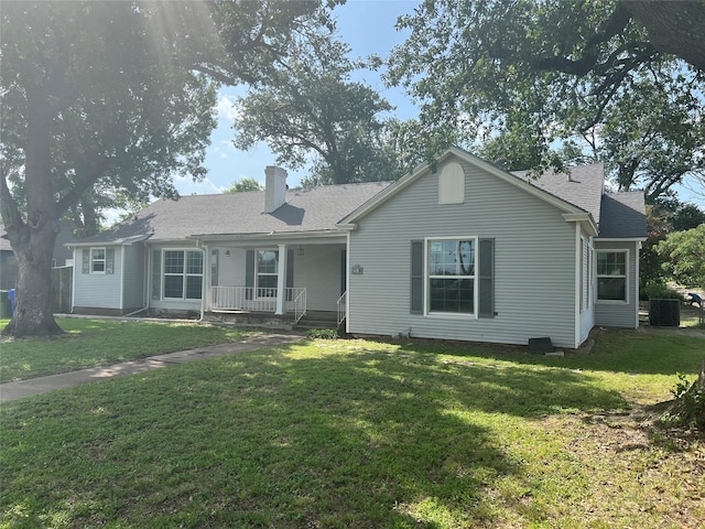 2928 Pine Ave, Waco, TX 76708 - ranch-style house featuring covered porch, a front yard, a chimney, and roof with shingles