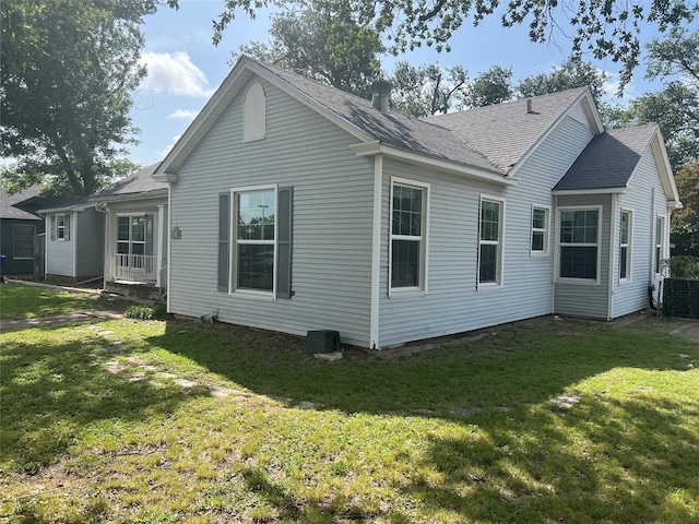 2928 Pine Ave, Waco, TX 76708 - back of house featuring a yard and a shingled roof