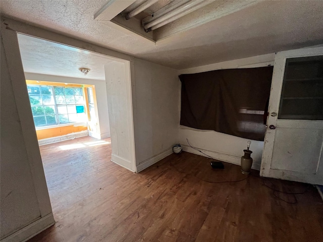 2928 Pine Ave, Waco, TX 76708 - unfurnished room with wood finished floors and a textured ceiling