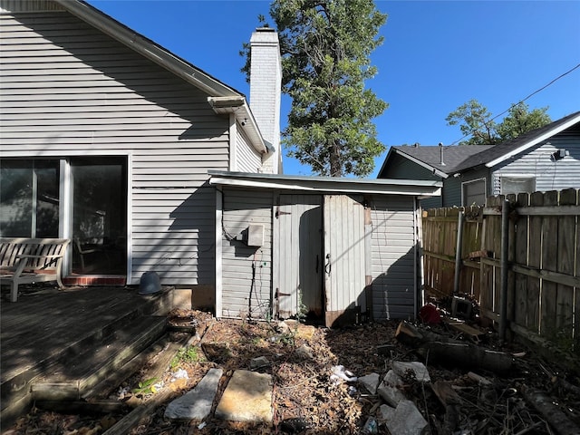 2928 Pine Ave, Waco, TX 76708 - back of house with a chimney, a deck, and a storage shed