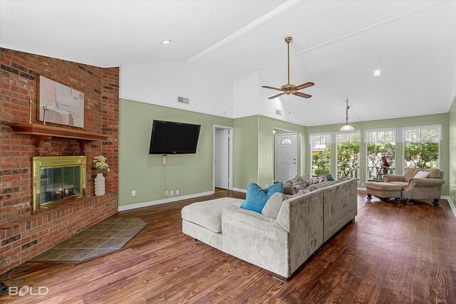 110 Elmview Ln, Haughton, LA 71037 - living room with dark wood-style flooring, vaulted ceiling, a ceiling fan, and a fireplace