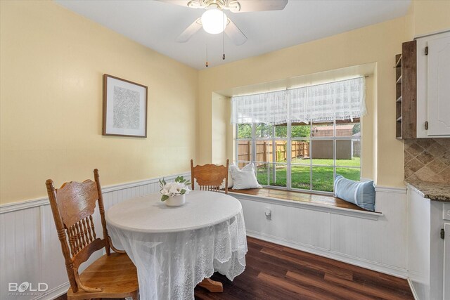 110 Elmview Ln, Haughton, LA 71037 - dining space with wainscoting, dark wood-type flooring, and ceiling fan