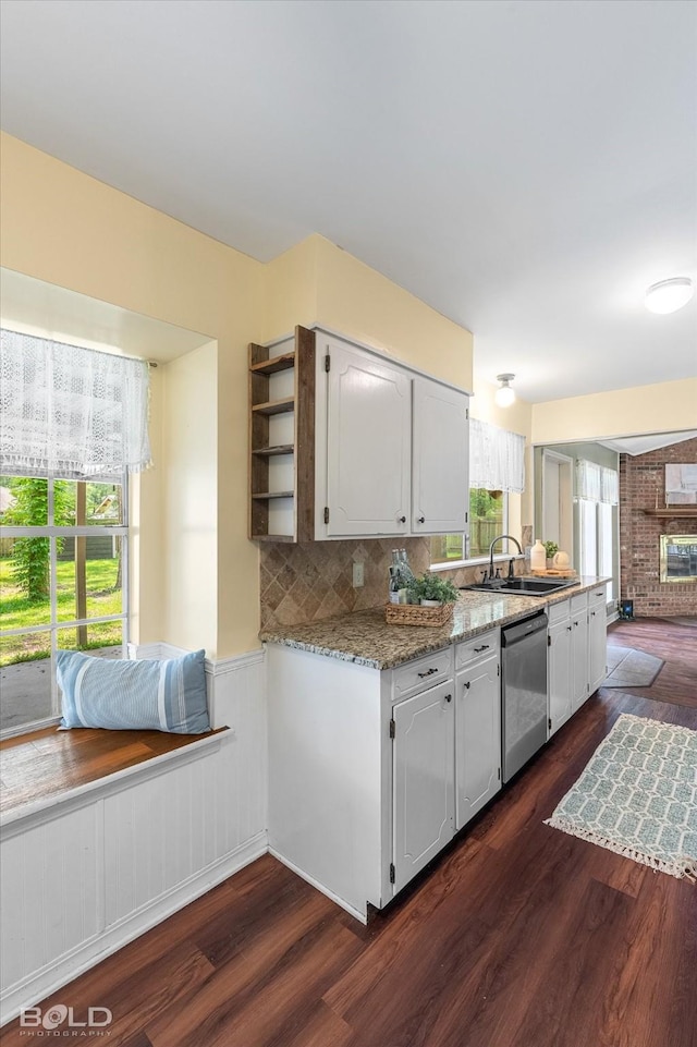 110 Elmview Ln, Haughton, LA 71037 - kitchen with stainless steel dishwasher, healthy amount of natural light, a wainscoted wall, dark wood-style floors, and white cabinets