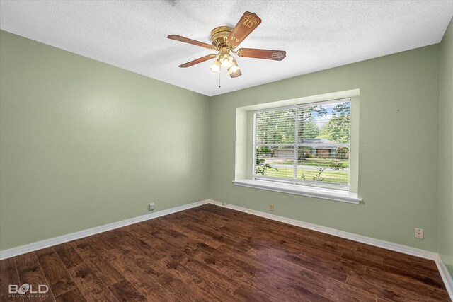 110 Elmview Ln, Haughton, LA 71037 - unfurnished room with dark wood finished floors, ceiling fan, and a textured ceiling