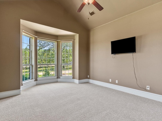 830 Cemetery Rd, Decatur, TX 76234 - spare room featuring carpet floors, a ceiling fan, and vaulted ceiling
