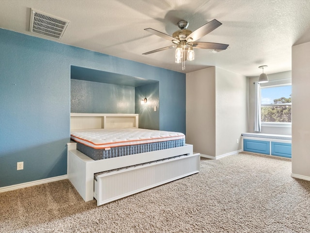830 Cemetery Rd, Decatur, TX 76234 - carpeted bedroom featuring ceiling fan and a textured ceiling
