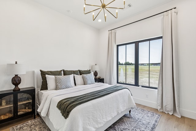 1890 Mcconnell Rd, Gunter, TX 75058 - bedroom with light wood-type flooring, a chandelier, and recessed lighting