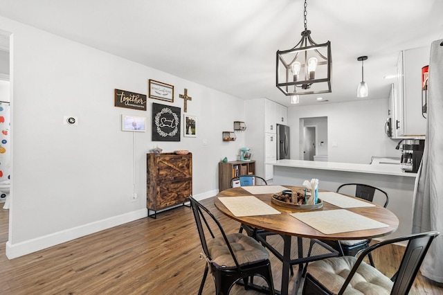 1204 Maxfield St, Bellmead, TX 76705 - dining area featuring wood finished floors and a chandelier