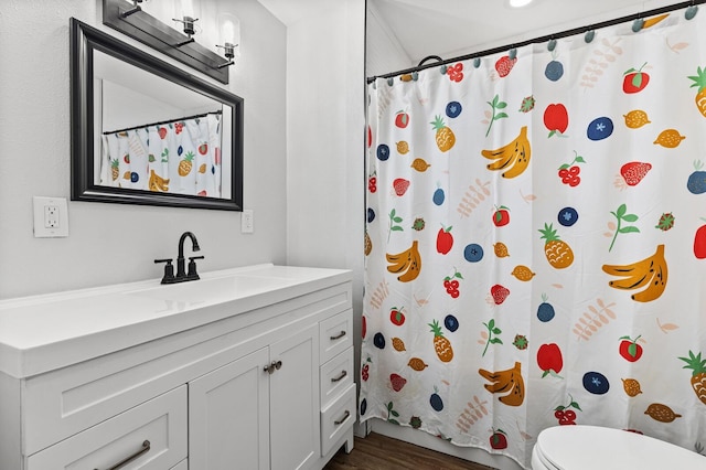 1204 Maxfield St, Bellmead, TX 76705 - full bathroom featuring vanity, wood finished floors, and curtained shower