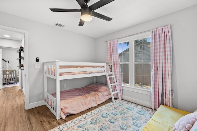 1204 Maxfield St, Bellmead, TX 76705 - bedroom featuring wood finished floors, multiple windows, and ceiling fan