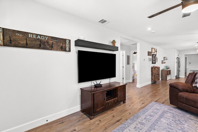 1204 Maxfield St, Bellmead, TX 76705 - living area with a ceiling fan, light wood finished floors, and recessed lighting