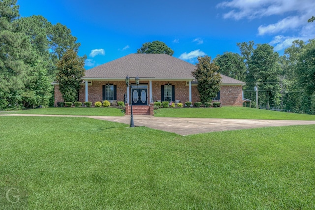 133 Downs Dr, Benton, LA 71006 - view of front of house featuring a front yard, brick siding, and a shingled roof