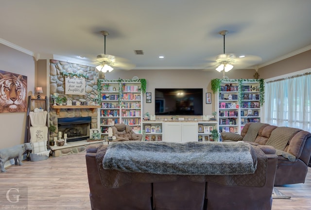 133 Downs Dr, Benton, LA 71006 - living room with ceiling fan, light wood finished floors, crown molding, a fireplace, and recessed lighting