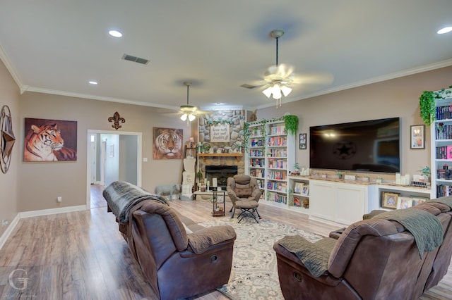133 Downs Dr, Benton, LA 71006 - living room featuring a ceiling fan, light wood-style floors, crown molding, a fireplace, and recessed lighting