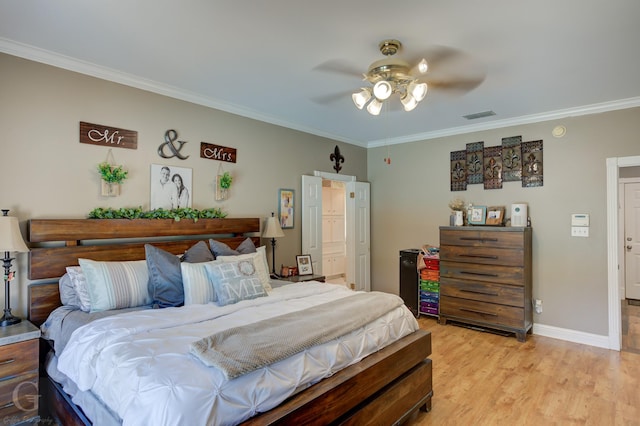 133 Downs Dr, Benton, LA 71006 - bedroom with ornamental molding, light wood-style flooring, and a ceiling fan