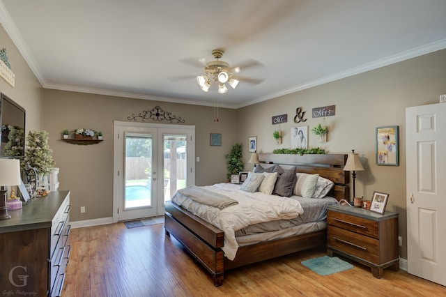 133 Downs Dr, Benton, LA 71006 - bedroom featuring access to outside, french doors, light wood-type flooring, crown molding, and ceiling fan