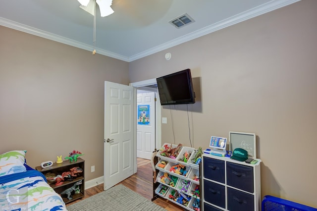 133 Downs Dr, Benton, LA 71006 - bedroom featuring crown molding, wood finished floors, and a ceiling fan