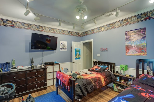 133 Downs Dr, Benton, LA 71006 - bedroom with track lighting, wood finished floors, and a ceiling fan