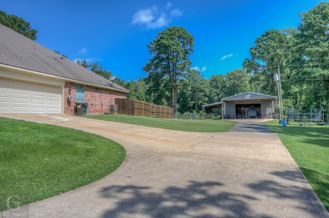 133 Downs Dr, Benton, LA 71006 - view of home's community featuring concrete driveway and a pole building
