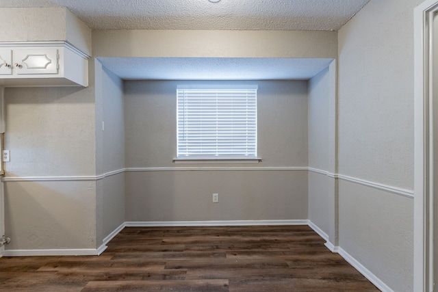 5209 Wolens Way, Fort Worth, TX 76133 - empty room featuring dark wood-type flooring and baseboards