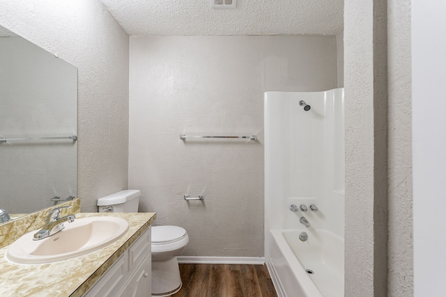 5209 Wolens Way, Fort Worth, TX 76133 - full bath with wood finished floors, vanity, a textured ceiling, and tub / shower combination