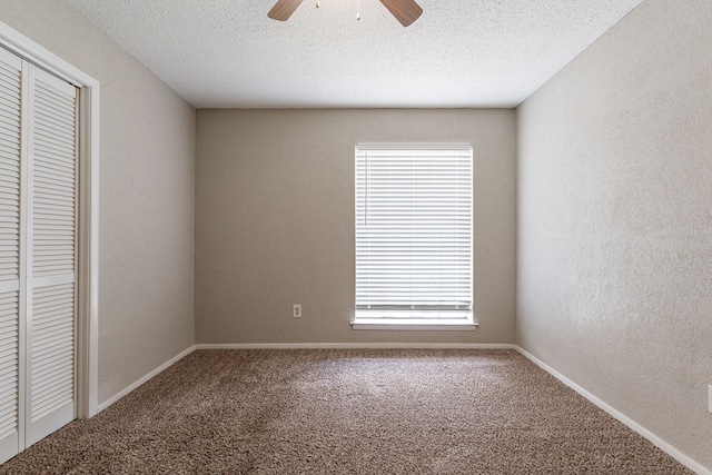 5209 Wolens Way, Fort Worth, TX 76133 - unfurnished bedroom with carpet, a closet, a ceiling fan, a textured ceiling, and a textured wall
