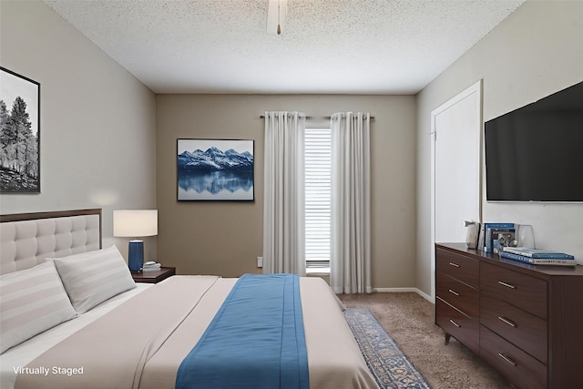 5209 Wolens Way, Fort Worth, TX 76133 - bedroom featuring carpet flooring and a textured ceiling