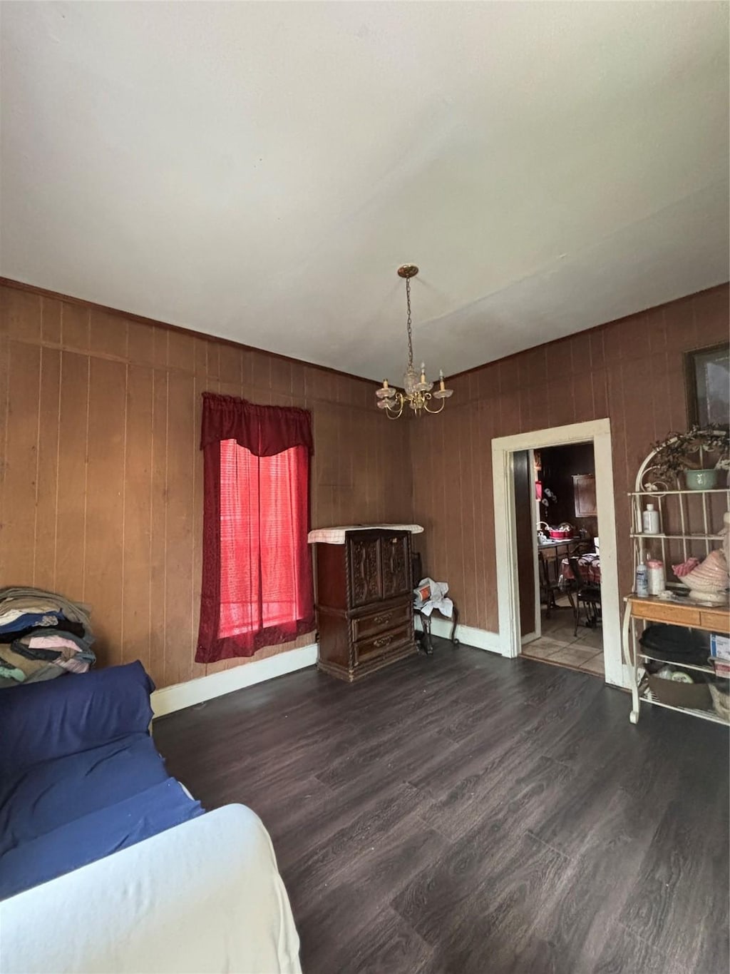 817 W Ellis St, Sherman, TX 75092 - bedroom with a chandelier and wood finished floors