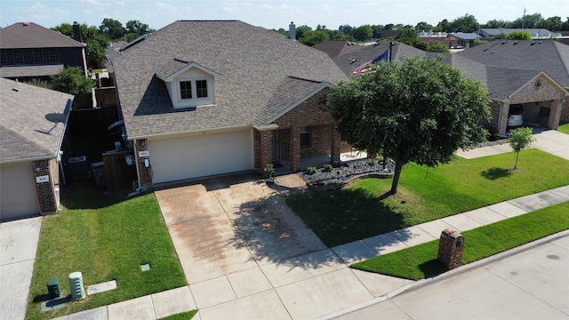 484 Harding Ln, Lavon, TX 75166 - view of front of property with brick siding, driveway, a shingled roof, and a front yard