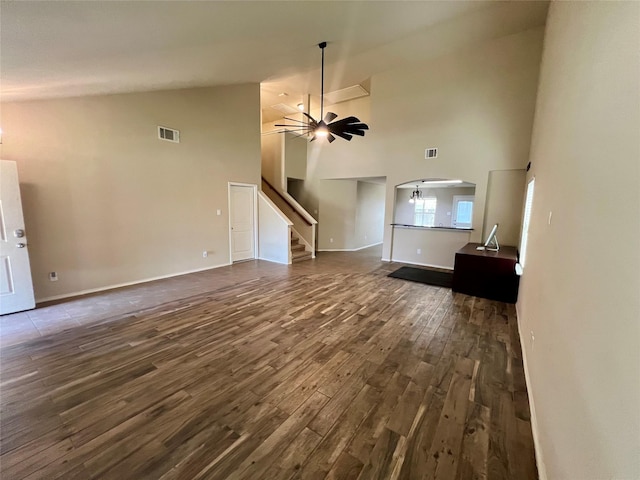 484 Harding Ln, Lavon, TX 75166 - unfurnished living room featuring dark wood-type flooring, high vaulted ceiling, stairs, and ceiling fan