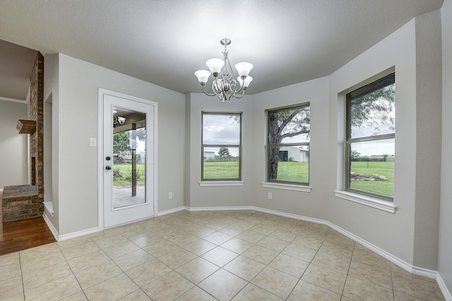 11440 Mitchell Cir, Ponder, TX 76259 - unfurnished dining area with plenty of natural light, a chandelier, and light tile patterned floors