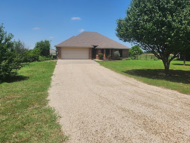11440 Mitchell Cir, Ponder, TX 76259 - ranch-style house with driveway and an attached garage