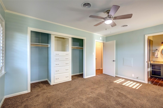 1521 Church St, Sulphur Springs, TX 75482 - unfurnished bedroom featuring carpet, crown molding, a closet, connected bathroom, and a ceiling fan