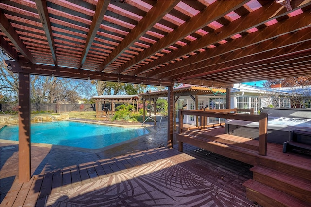 1521 Church St, Sulphur Springs, TX 75482 - view of swimming pool with a covered hot tub, a deck, a fenced backyard, and a pergola