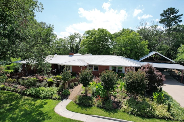 1521 Church St, Sulphur Springs, TX 75482 - single story home with driveway, a metal roof, and a carport