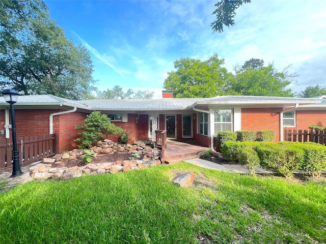 1521 Church St, Sulphur Springs, TX 75482 - ranch-style home with brick siding, a chimney, covered porch, and a metal roof
