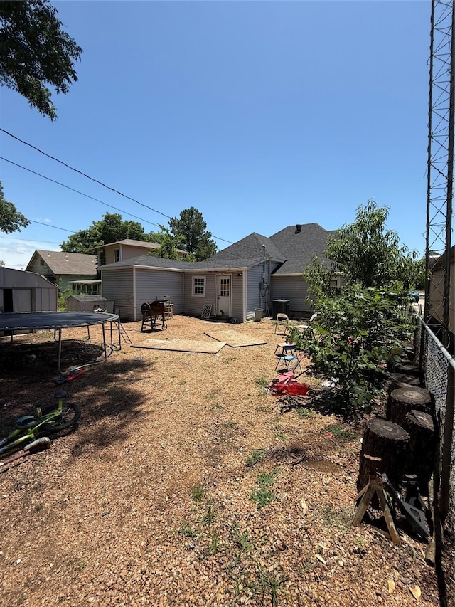 1027 W Crawford St, Denison, TX 75020 - view of yard featuring a trampoline