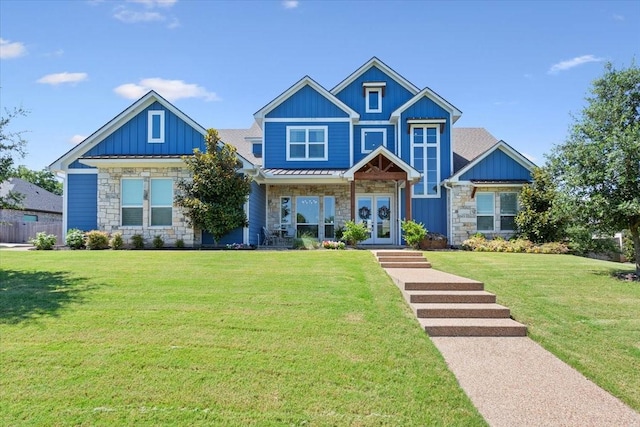 400 Wycliff Dr, China Spring, TX 76633 - craftsman inspired home featuring stone siding, french doors, a front lawn, and board and batten siding