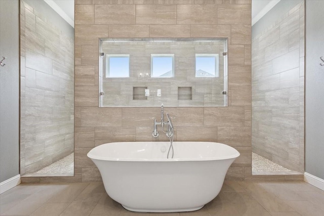 400 Wycliff Dr, China Spring, TX 76633 - full bathroom featuring a soaking tub, plenty of natural light, a walk in shower, and tile walls