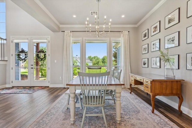 400 Wycliff Dr, China Spring, TX 76633 - dining area featuring wood finished floors, french doors, healthy amount of natural light, a chandelier, and crown molding