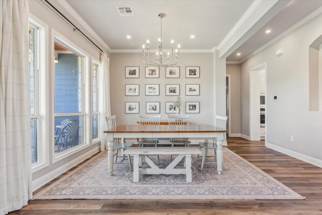 400 Wycliff Dr, China Spring, TX 76633 - dining room featuring wood finished floors, a chandelier, crown molding, recessed lighting, and arched walkways