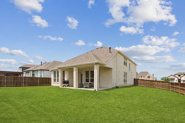 1814 Cypress Gap Trl, Mansfield, TX 76063 - back of property with a fenced backyard, a patio area, brick siding, and roof with shingles