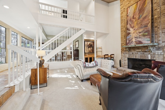 6250 Twin Oaks Cir, Dallas, TX 75240 - carpeted living room featuring a high ceiling, stairway, a large fireplace, and recessed lighting