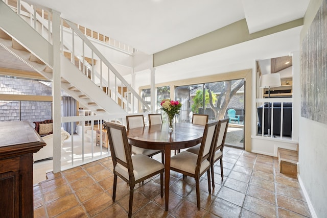 6250 Twin Oaks Cir, Dallas, TX 75240 - dining area with stairs and stone tile floors