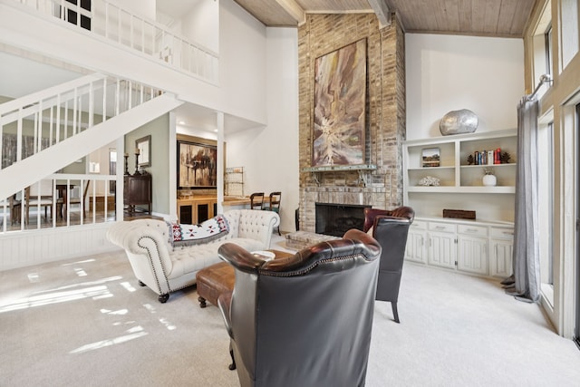 6250 Twin Oaks Cir, Dallas, TX 75240 - living room featuring light carpet, high vaulted ceiling, wood ceiling, a fireplace, and stairs