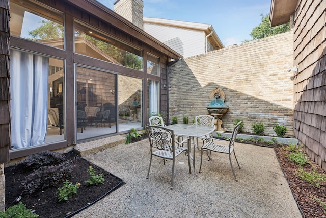 6250 Twin Oaks Cir, Dallas, TX 75240 - view of patio with outdoor dining space and a sunroom