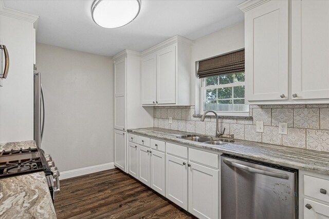 4632 Ivanhoe Dr, Fort Worth, TX 76132 - kitchen featuring stainless steel appliances, decorative backsplash, dark wood-type flooring, white cabinetry, and light stone countertops
