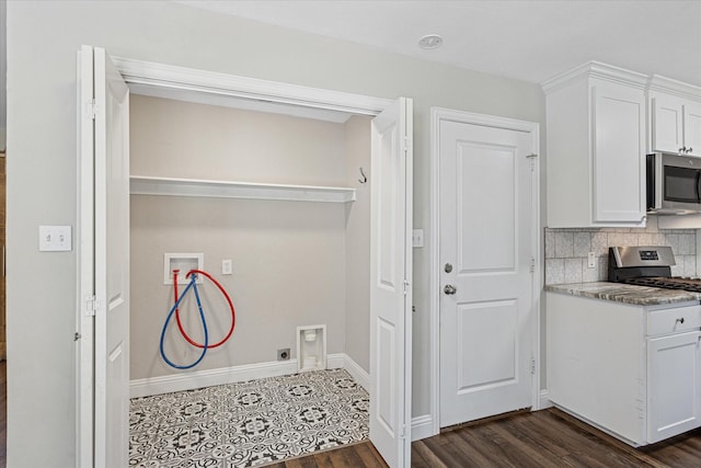 4632 Ivanhoe Dr, Fort Worth, TX 76132 - laundry area featuring washer hookup and dark wood-style floors